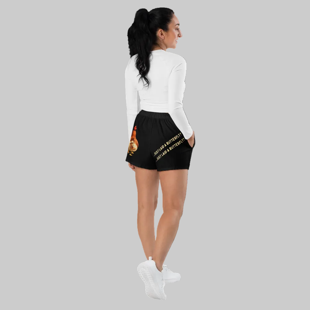 Woman wearing black shorts with gold text on a white background