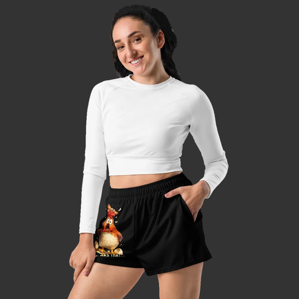 Woman wearing a white long-sleeve top and black shorts with a fox design on a white background